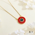 Macro shot of evil eye pendant necklace with colorful zircons and red enamel details - Red Round Style (NE2255-A-1)