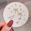 Detailed set of assorted stud earrings including bow, star, and pearl designs on card - Gold Bowknot Pearl (E0287-1)