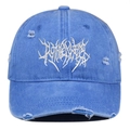 Close-up of blue distressed baseball cap with white gothic embroidery and ripped details - Light Blue