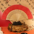 Chinese vintage folding fan with red bamboo frame and intricate cutout design - Large Edge Red Wood