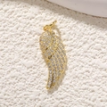 Macro shot of gold-plated angel wing pendant with shimmering pavé crystal details - Gold Full Zirconia Wing