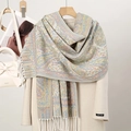 Detailed view of paisley core-spun yarn scarf with tassels on beige coat - Soft Multi-color (T482-09)