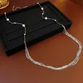 Elegante collana lunga argento multistrato con perle bianche e catene a cascata - Collana - Argento