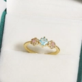 Gold ring with square blue zircon and floral accents in a white velvet jewelry box - Light Blue Square Gemstone with Flower and Milgrain Style (金色33)