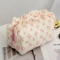 Floral quilted cosmetic bag with pink bows, ruffled edges and a zip closure - Bowknot Lace Cosmetic Bag