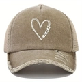 Detail view of khaki distressed mesh cap featuring printed heart and butterfly patterns - Khaki