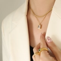 Double-layer gold necklace with a sleek blade chain and rectangular zircon pendant - Double Layer Necklace / Gold
