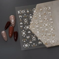 3D embossed nail sticker Co-311 featuring white floral and gold totem relief patterns - 5D Relief Gold Stamping Style (CO-311)