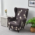 Elastic wingback chair cover with white magnolia pattern on a dark brown background - Magnolia Coffee