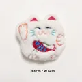 Detail view of 6x6cm plush lucky cat brooch with embroidery and red carp fish - Lucky Cat White
