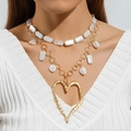 Detail of layered gold-tone necklace with faux pearls and a large hollow heart pendant - Gold (Layered Rectangle Pearl Metal Chain Gold Heart)