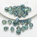Iridescent blue skull-shaped 8x10mm beads for DIY Halloween bracelets and necklaces - Transparent Green