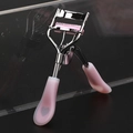 Pink eyelash curler with heart-pattern handle and silver metal frame for makeup - Chrome Curler with Heart Silicone Handle Comb Matching Rubber Pad