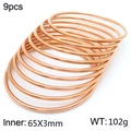 9-piece set of 3mm rose gold plated stainless steel bangles stacked on white background - 9Pcs Set-Rose Gold (KB184102-LO)