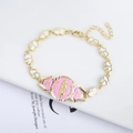 Detail of 18K gold plated heart bracelet with pink enamel Virgin Mary pendant - White Heart Link Guadalupe Pink Medal Bracelet