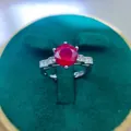 Macro detail of a 2-carat red ruby ring featuring a six-prong setting on white metal - A7 Open Type / Red