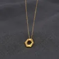 Detailed view of a gold geometric hexagonal pendant necklace with a delicate link chain - Hexagon