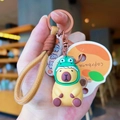 Luminous Capybara keychain in frog costume with brown woven lanyard and orange card - Buddhist Capybara