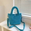 Bright blue corduroy bucket bag with plush texture, round handles and adjustable strap - Light Blue