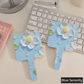 Blue serenity impasto floral hand mirror with relief oil painting effect on the back - 02 Quiet Blue