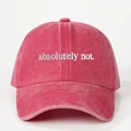 Macro shot of vintage washed red cotton baseball cap with white embroidery - Red
