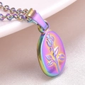 Macro shot of 18k gold plated rainbow stainless steel oval pendant with rose engraving - Rainbow---Necklace