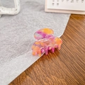 Mini acetate hair claw clip featuring pink and orange marble texture for styling - Orange Red