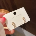 Detalle de pendientes de lazo dorado con micro circonitas sobre pernos de plata S925 - 75# Diamantes de Imitación Poste de Plata