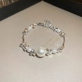 Macro detail of French style pearl bracelet with irregular silver beads and extender chain - Silver Pearl Bracelet