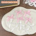 Set of 10 handmade 4cm satin bows in pink and white for DIY crafts and gift decor - Wide Pink White