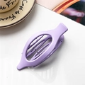 Detail view of a large purple frosted oval claw clip with functional comb teeth design - Matte Lavender