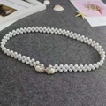 White pearl elastic waist chain featuring a sparkling rhinestone butterfly buckle - Two Pearls