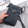 Black touch screen phone crossbody bag with gold heart buckle and litchi grain texture - Black