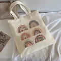 Cream canvas tote bag featuring six bohemian rainbow prints in soft Morandi colors - C16 Boho Rainbow