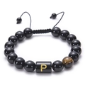 Macro detail of adjustable black onyx bead bracelet with tiger eye stone and letter P charm - Letter P