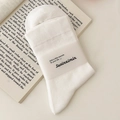 Chaussettes de maternité en coton blanc doux avec bandeau papier sur fond de livre - Taille unique / Blanc Clair de Lune