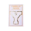 Detail of a white chenille letter Y patch with gold glitter edge and peel-and-stick backing - Letter Y / White