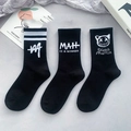 Mid-calf black cotton socks featuring diverse white graphic prints and athletic stripes - Black Numbered Style Set / Black