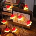 Festive Christmas LED string lights featuring warm glowing Santa Claus hat decorations - Christmas Hat