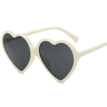 Fashionable heart-shaped cream white sunglasses with black lenses shown from a 45-degree angle - Beige Frame Gray Lens