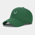 Close-up of the white smiley face embroidery on a dark green cotton baseball cap - Adjustable / Green