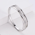 Modern silver multi-layer stainless steel bangle featuring sparkling zircon inlay accents - Steel