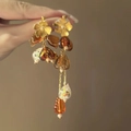 Detail of vintage style earrings with floral metal petals and amber tassel beads - Coffee-Gold (10# Silver Needle)