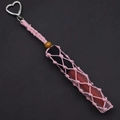 Detail of pink hand-woven lipstick holder keychain with heart-shaped silver metal clasp - Pink