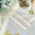 Detail of 25cm Christmas candles with Santa and gingerbread man prints on white mesh fabric - Christmas Berry (Light Pink)