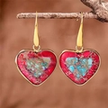 Detail of colorful imperial stone heart drop earrings hanging on a rustic wooden branch - Wrapped Heart Two-Tone