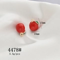 Detailed macro view of red enamel apple charms with 15x10mm size and 3.3g weight - 4478# Apple