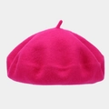 Detail of a rose red wool beret featuring warm felt texture and classic top stem design - One Size / Light Rose