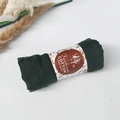 Pleated dark green cotton viscose scarf in roll display with floral paper wrap - Style #56