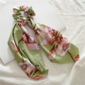 Detail of green satin scrunchie with pink floral pattern and long elegant ribbon - Green Big Floral